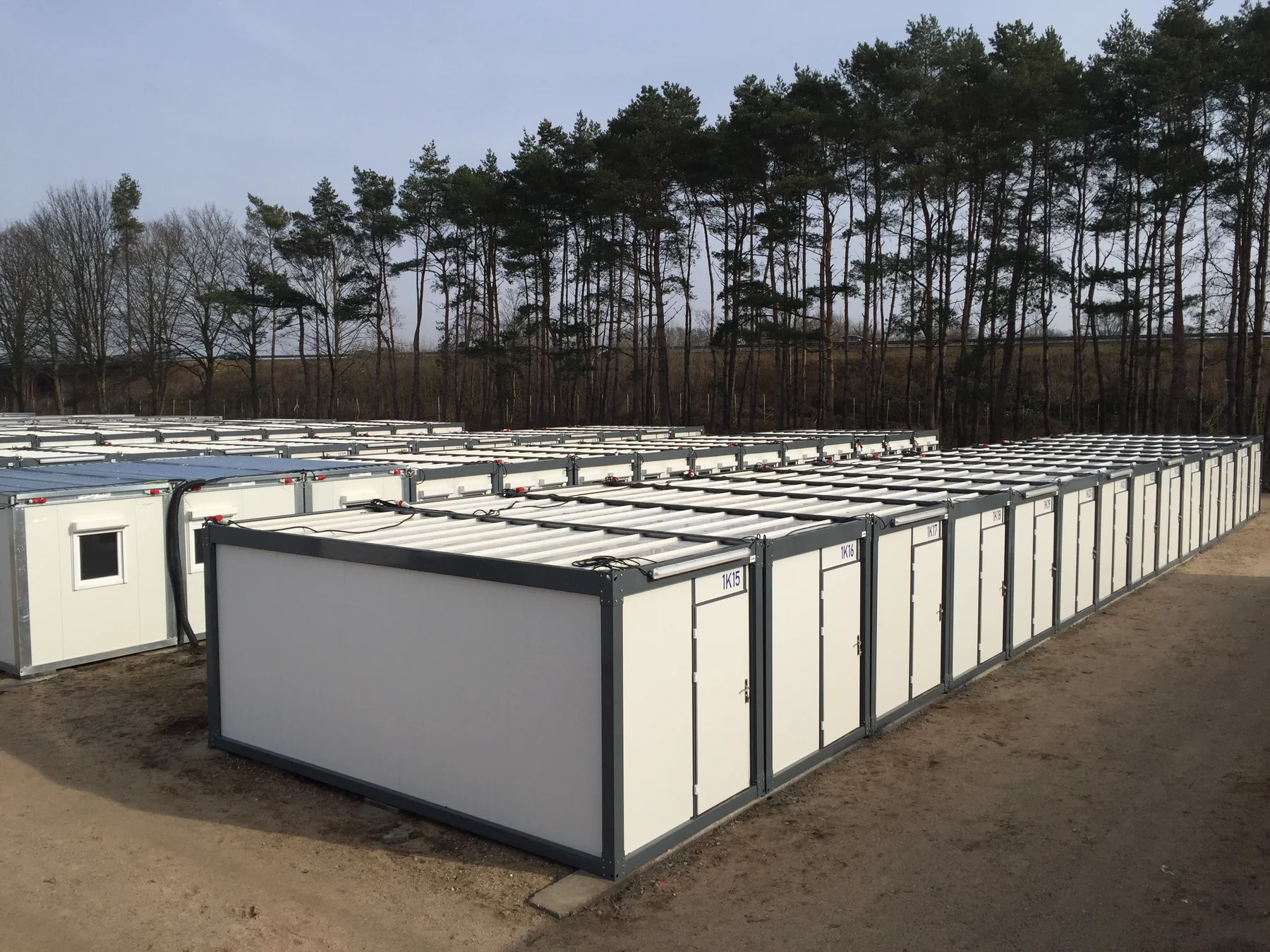 Rows of completed white modular units viewed across the Seeth site