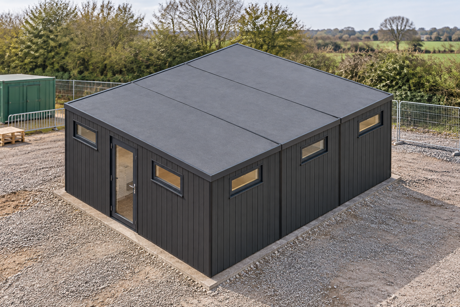 3-Module Modular Shower Block with WC Single-storey modular building with anthracite grooved cladding, glazed entrance and flat roof.