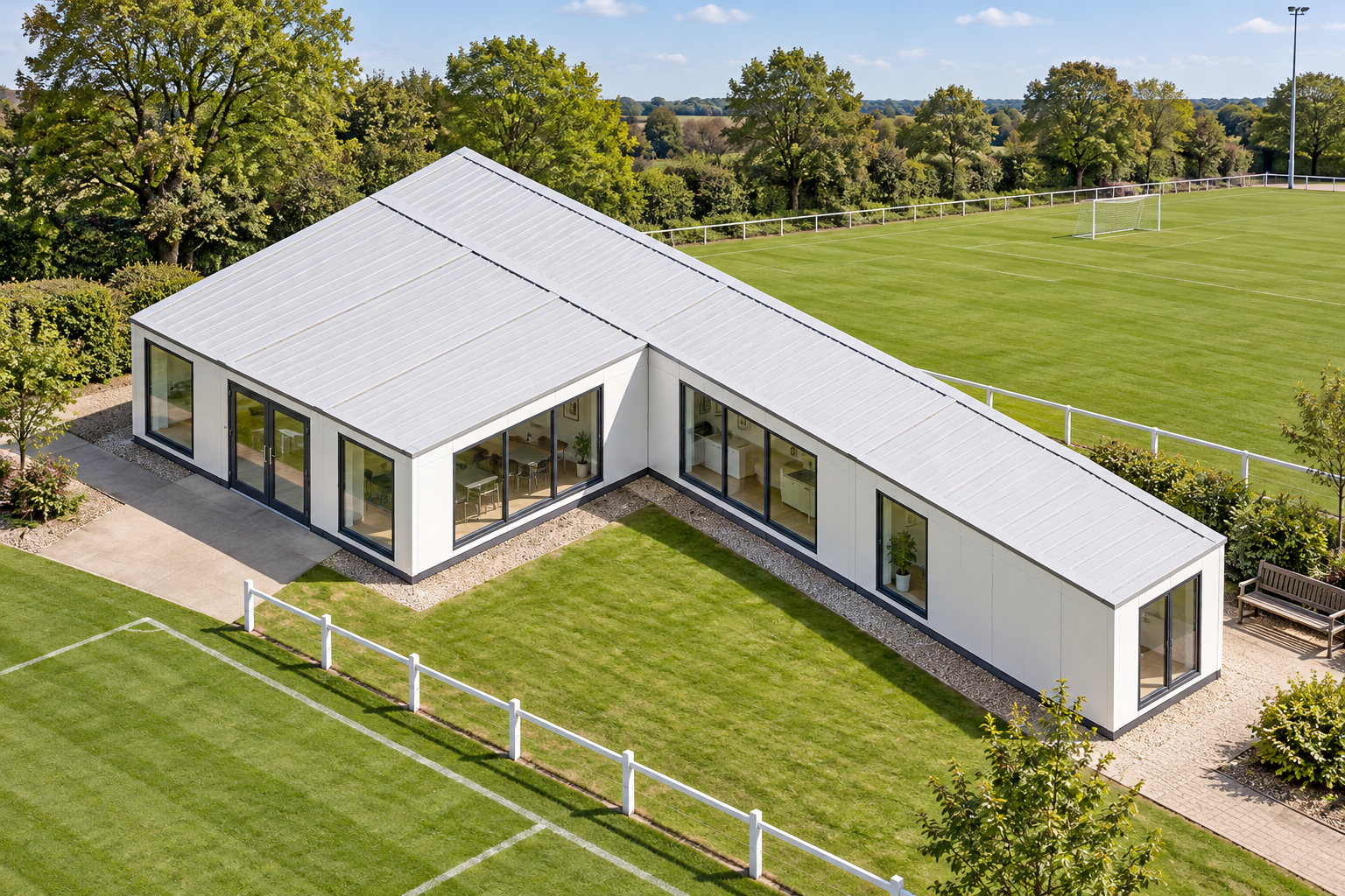 6-Module L-Shaped Modular Clubhouse L-shaped modular clubhouse beside a sports pitch in daylight